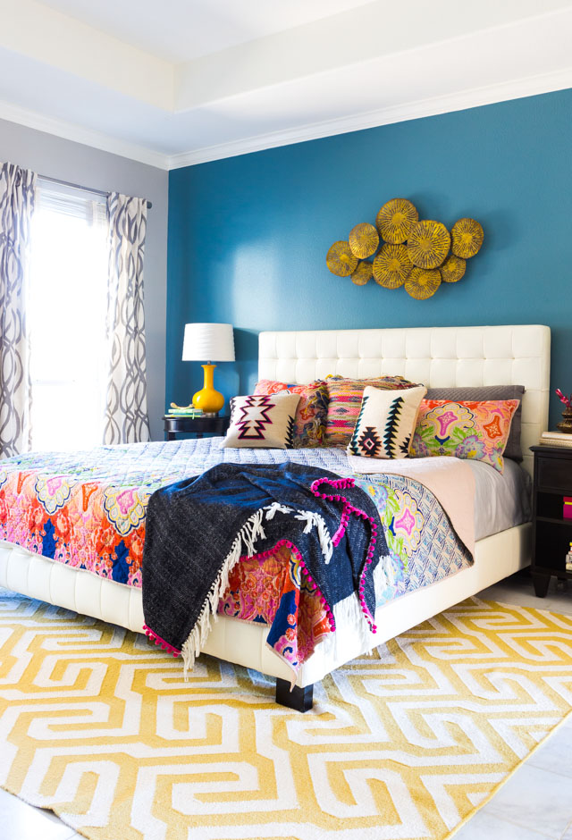 A vibrantly colored boho bedroom.