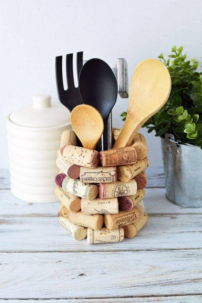 A kitchen utensil holder made out of wine corks.