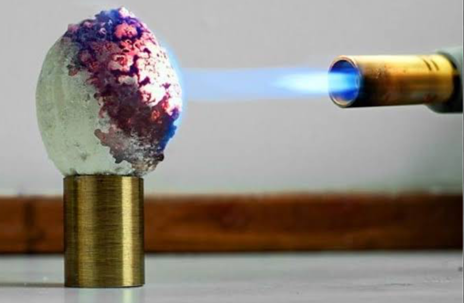 Using a torch to perform a Heat transfer test on DIY material.