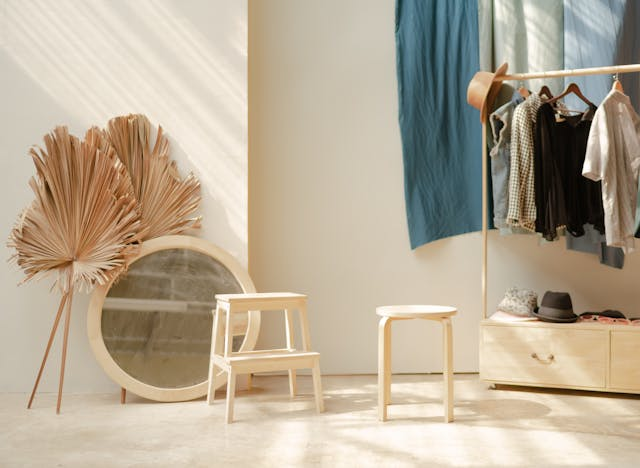 A room with a open wardrobe area.