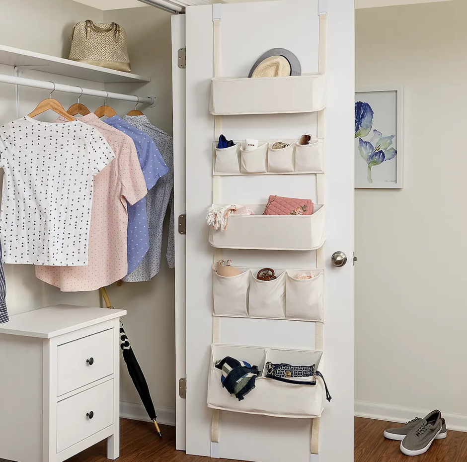 Closet door organizer with multiple hanging storage pockets