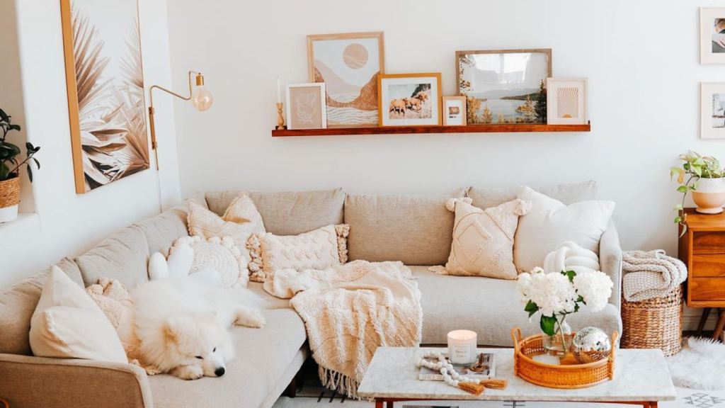 A cream colored L-Shaped couch in a living room.