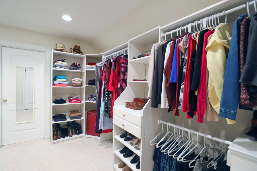 A nice built in shelving for a walk-in closet.