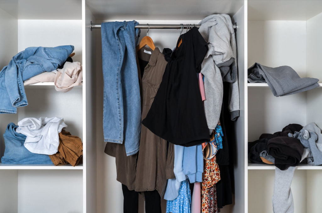 This overflowing closet is begging for a declutter and a seasonal storage solution