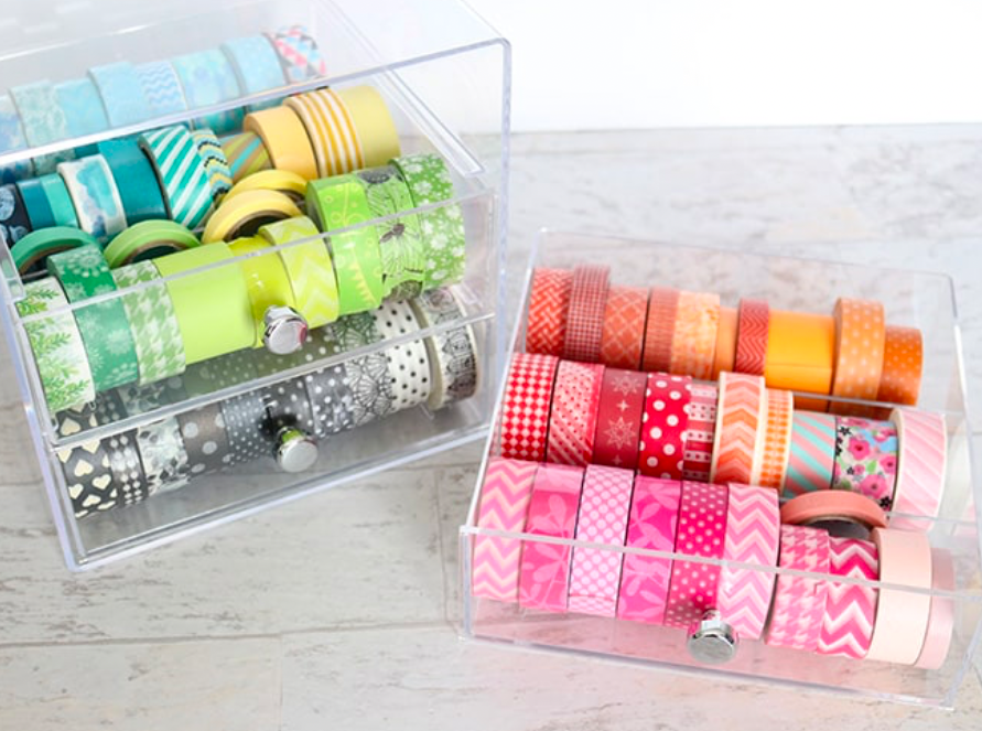 Clear acrylic organizers holding colorful washi tapes sorted neatly for craft and storage organization