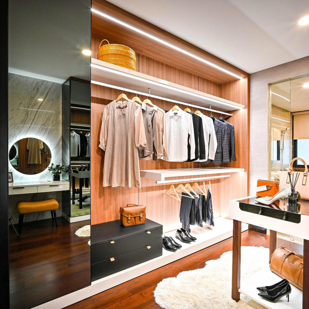 Contemporary walk-in closet with wood panel walls, open hanging racks, integrated lighting, and dressing area