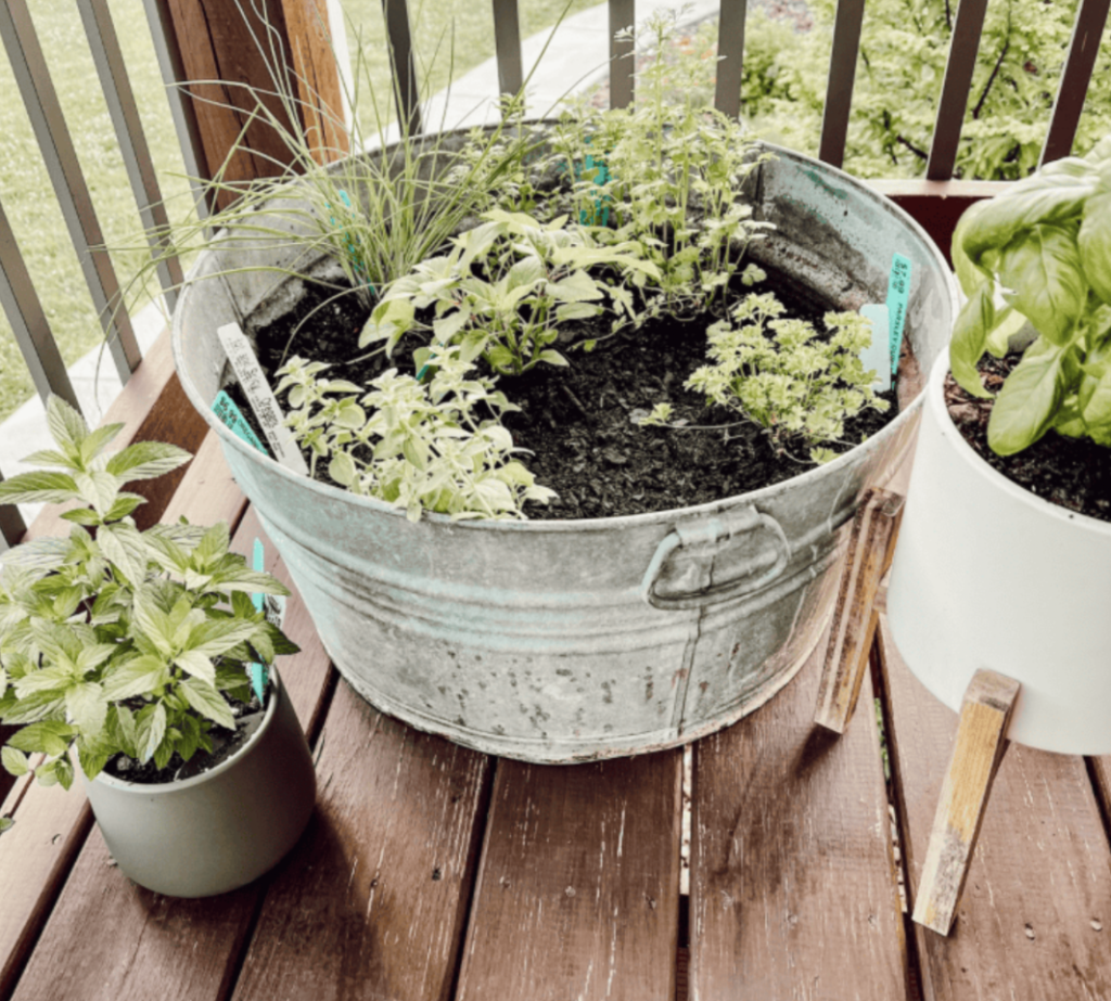 DIY raised wooden planter boxes with colorful flowers placed on patio for compact gardening