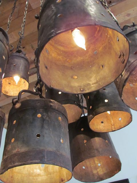 Hanging buckets with lights installed in their center with holes drilled in their sides prove that lighting and creativity go hand in hand