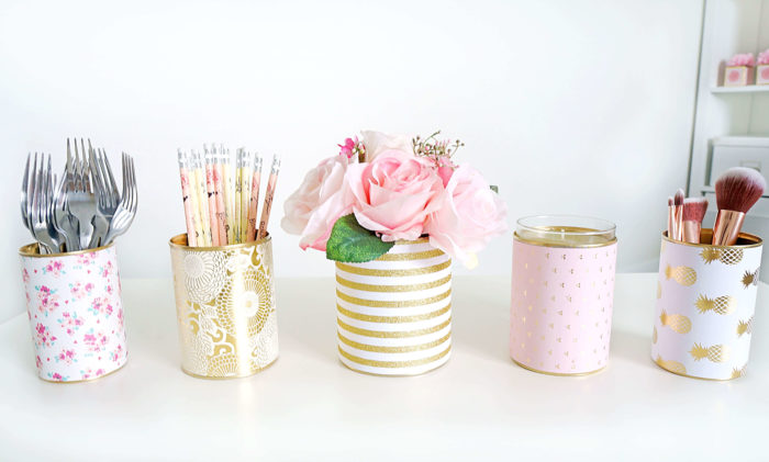 DIY decorative tin can organizers painted with floral and gold patterns for desk storage