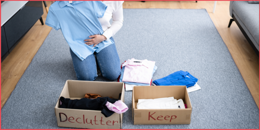 Person sorting clothes into declutter and keep boxes at home