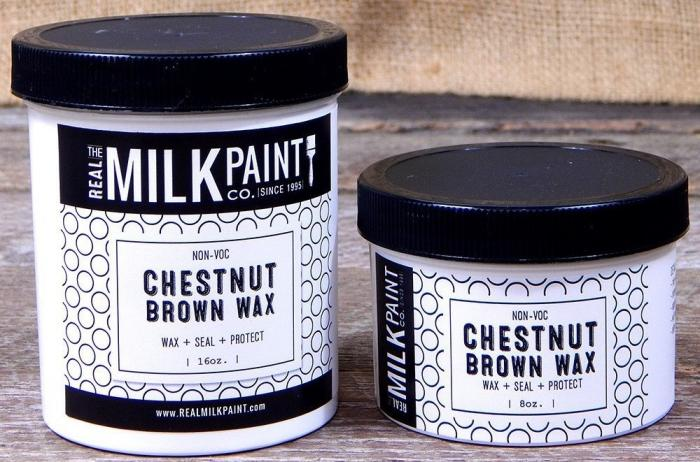 Two non-VOC Chestnut Brown Wax paints next to each other on a wooden floor.