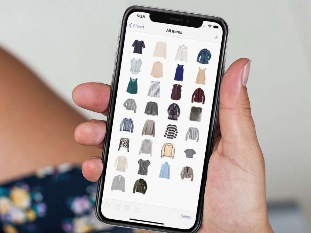 Mobile closet organizer app displaying digital wardrobe inventory on smartphone screen