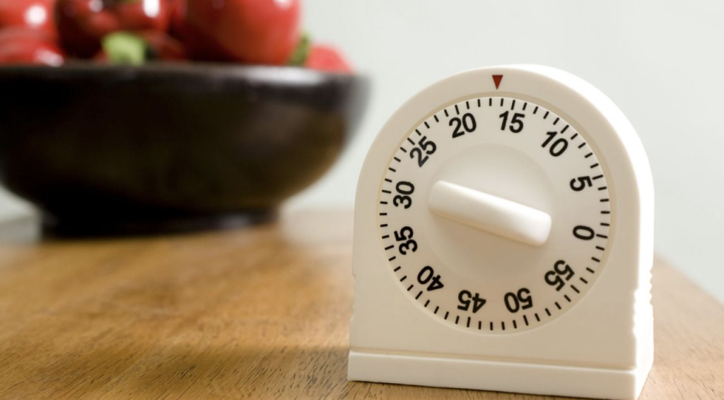 kitchen timer used for timed decluttering or cleaning productivity method