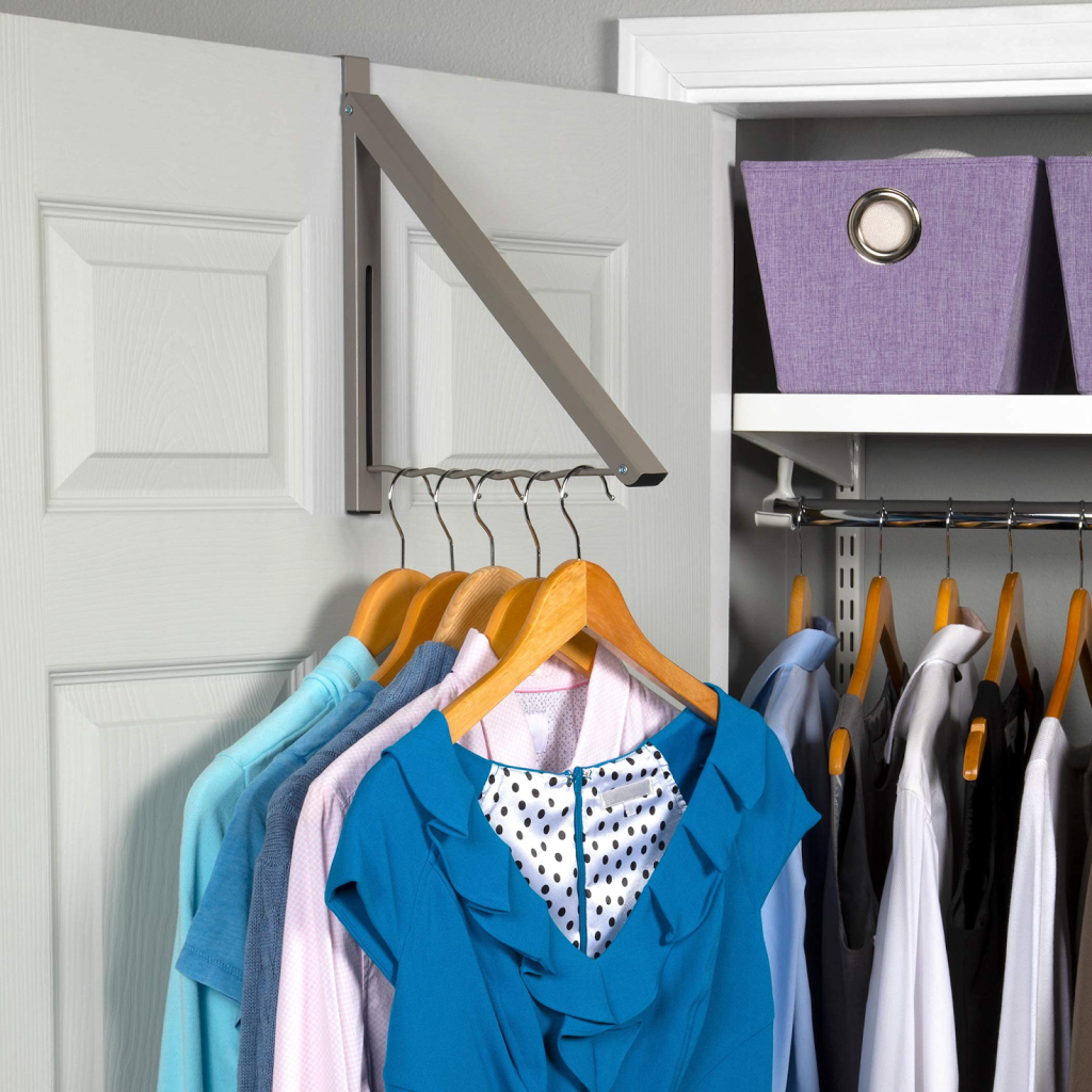 organized closet with clothes hanging on space saving wardrobe hanger rack
