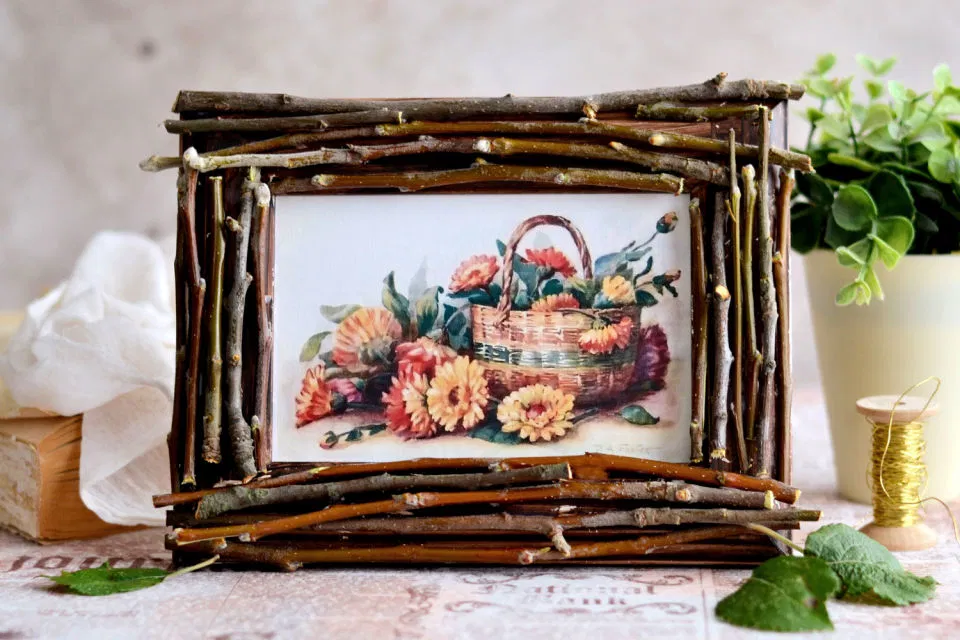 handmade rustic twig photo frame with natural wood sticks and floral artwork