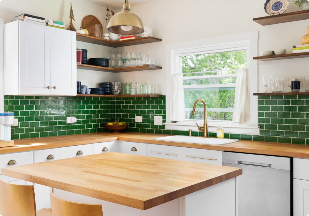 modern kitchen with green subway tile backsplash, wooden countertops and open shelving
