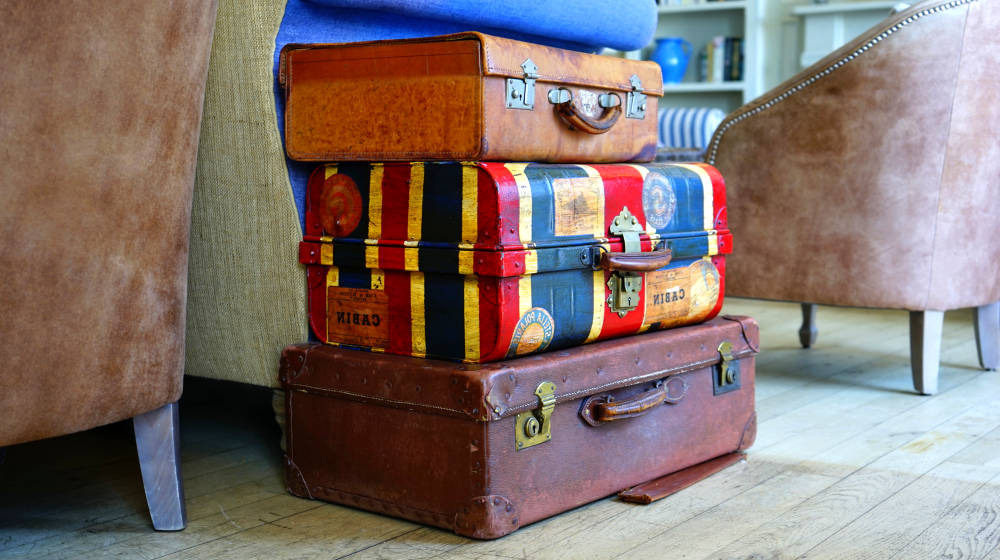 Stacked vintage suitcases in a living room