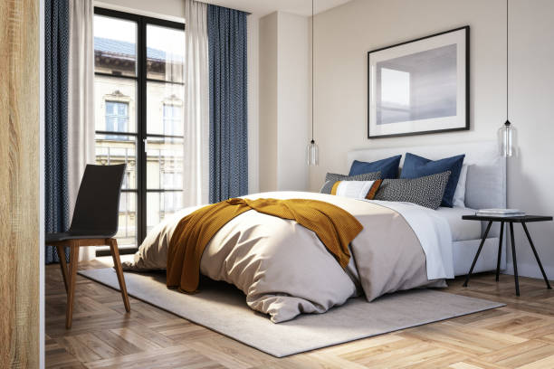 Modern bedroom with cozy bedding and mustard throw blanket.
