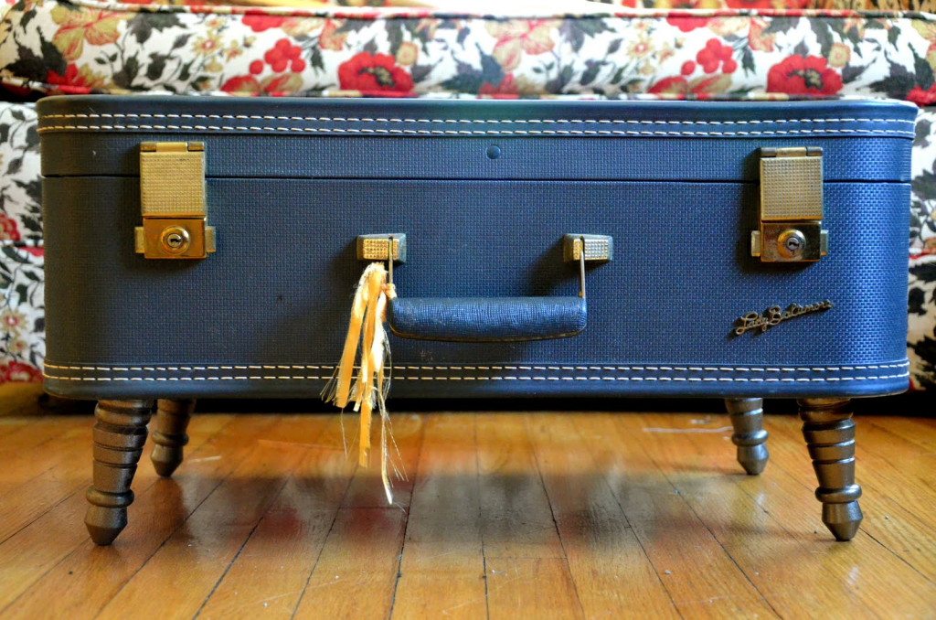 Blue vintage suitcase turned into furniture