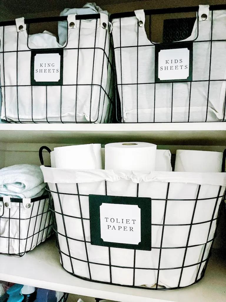 Wire storage bins labeled for bathroom essential