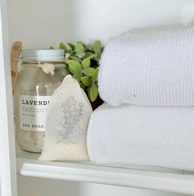 Lavender jar and towels on a neat shelf
