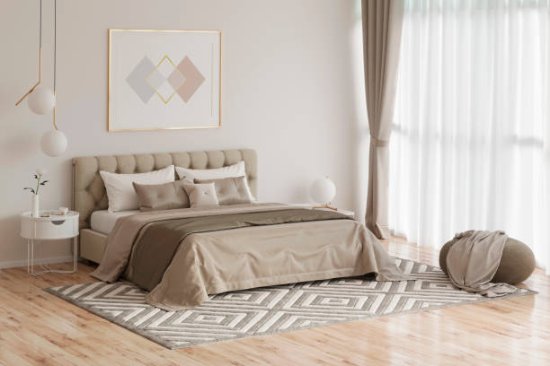 Soft-toned bedroom with geometric rug and sheer curtains
