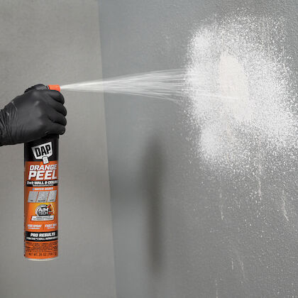 Orange peel spray being used to create a blank wall.