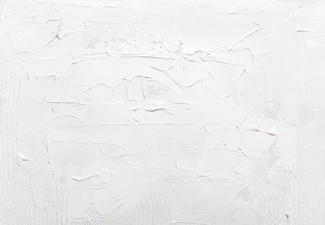 Textured off white paint lightening this rooms walls