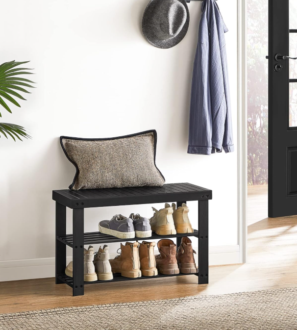 Organized shoe collection on multi-level wooden shelves.