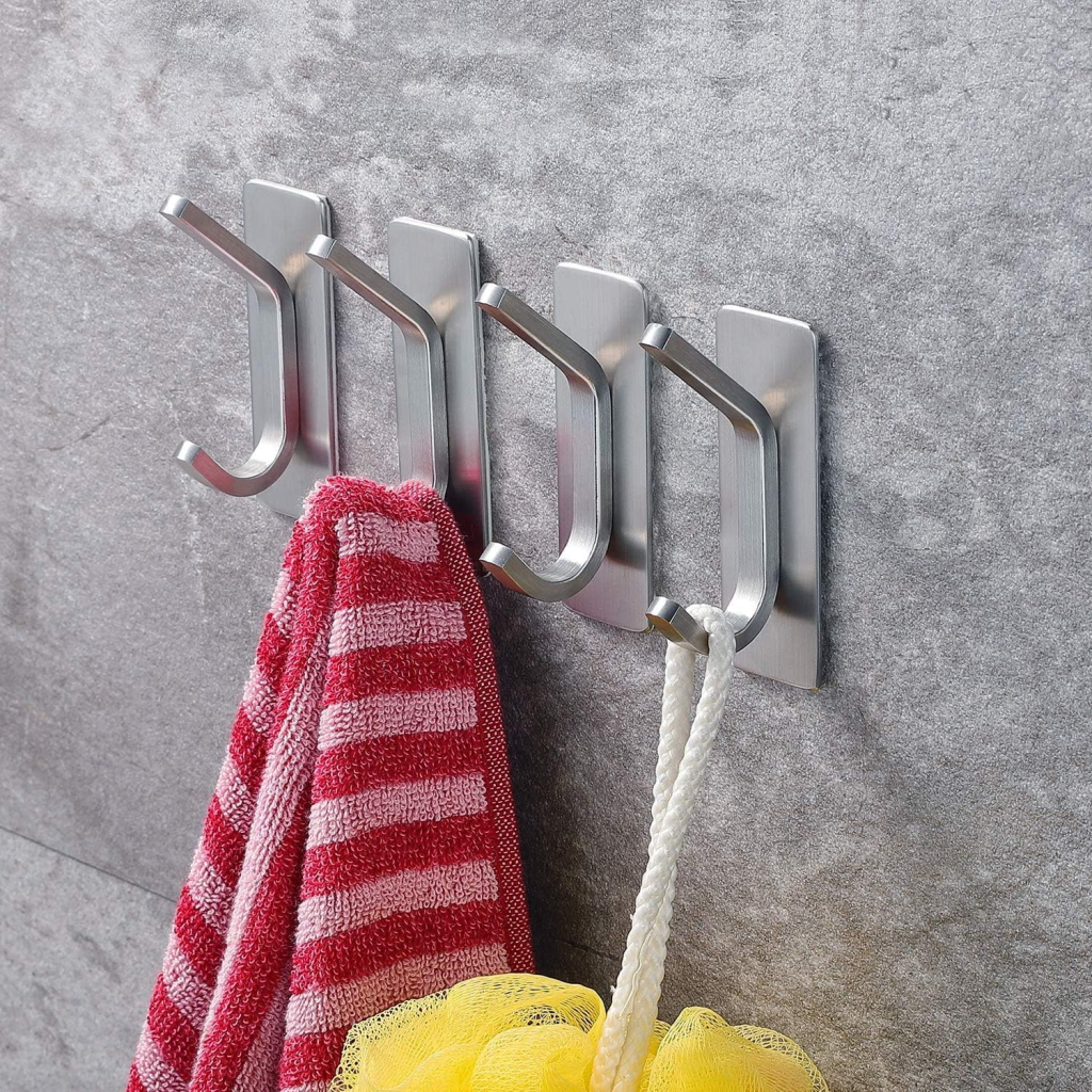 Stick-on hooks on a bathroom wall.