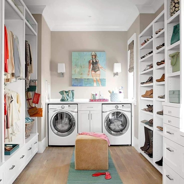 A washer-dryer in a walk im closet.