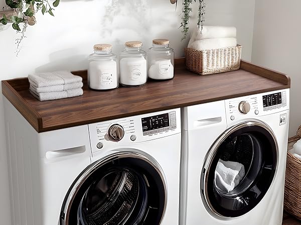 A flat surface shelf on top of a washer-dryer set as your folding station