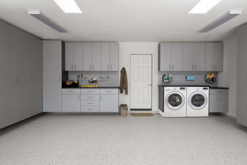 A washer-dryer set in a garage.