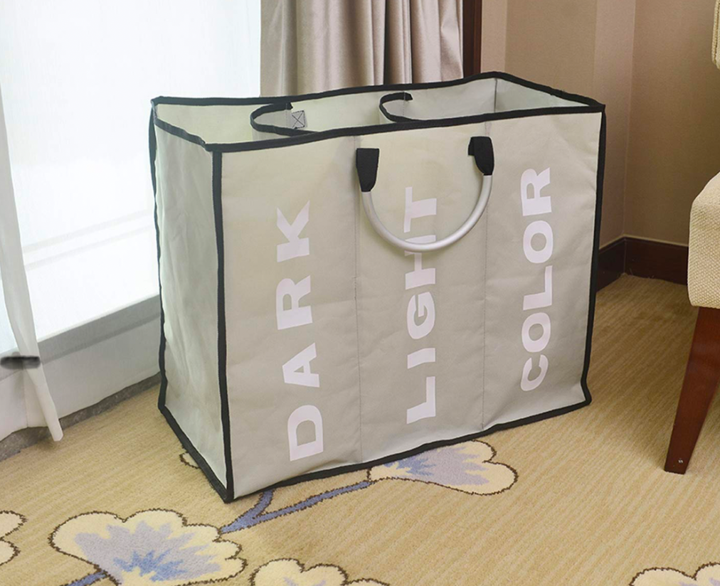 Sectioned hampers reading Dark, Light, Color to help separate clothing.