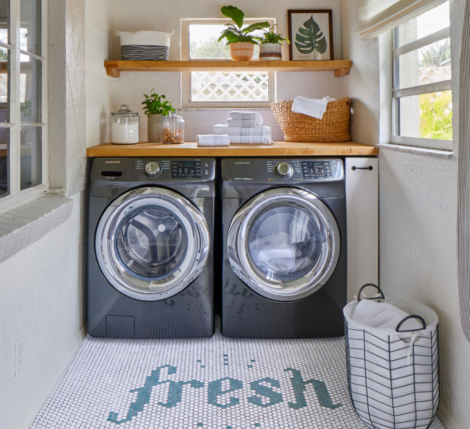 Narrow space turned in a laundry room with natural touces of wood shelving.