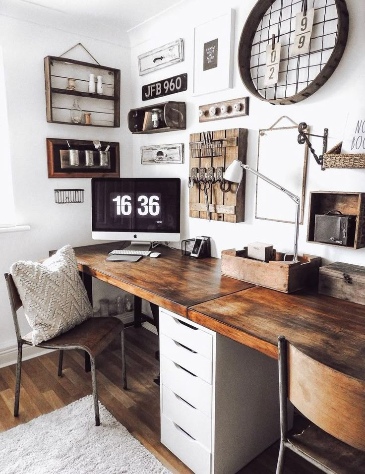 Rustic home office with wooden desk and wall decor.

