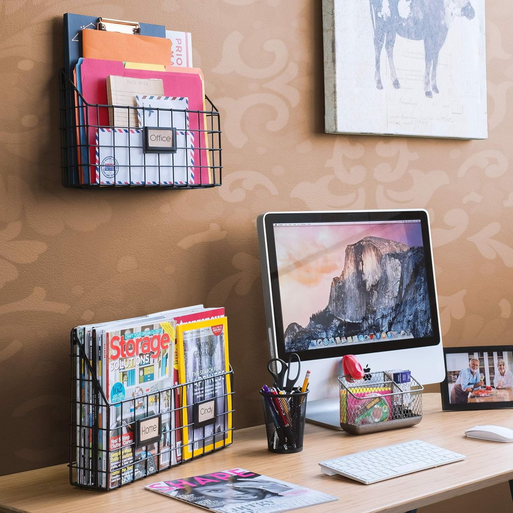 Rustic wall-mounted wire baskets with wood backing for holding letters.