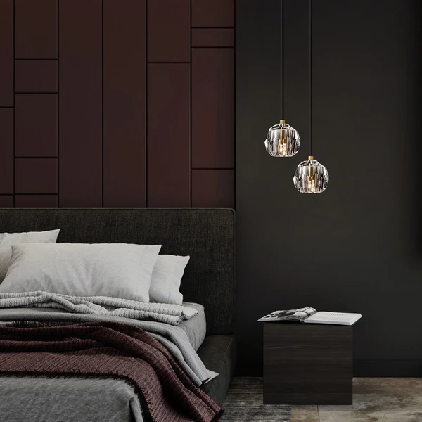 Minimal dark bedroom with pendant lights and simple decor.