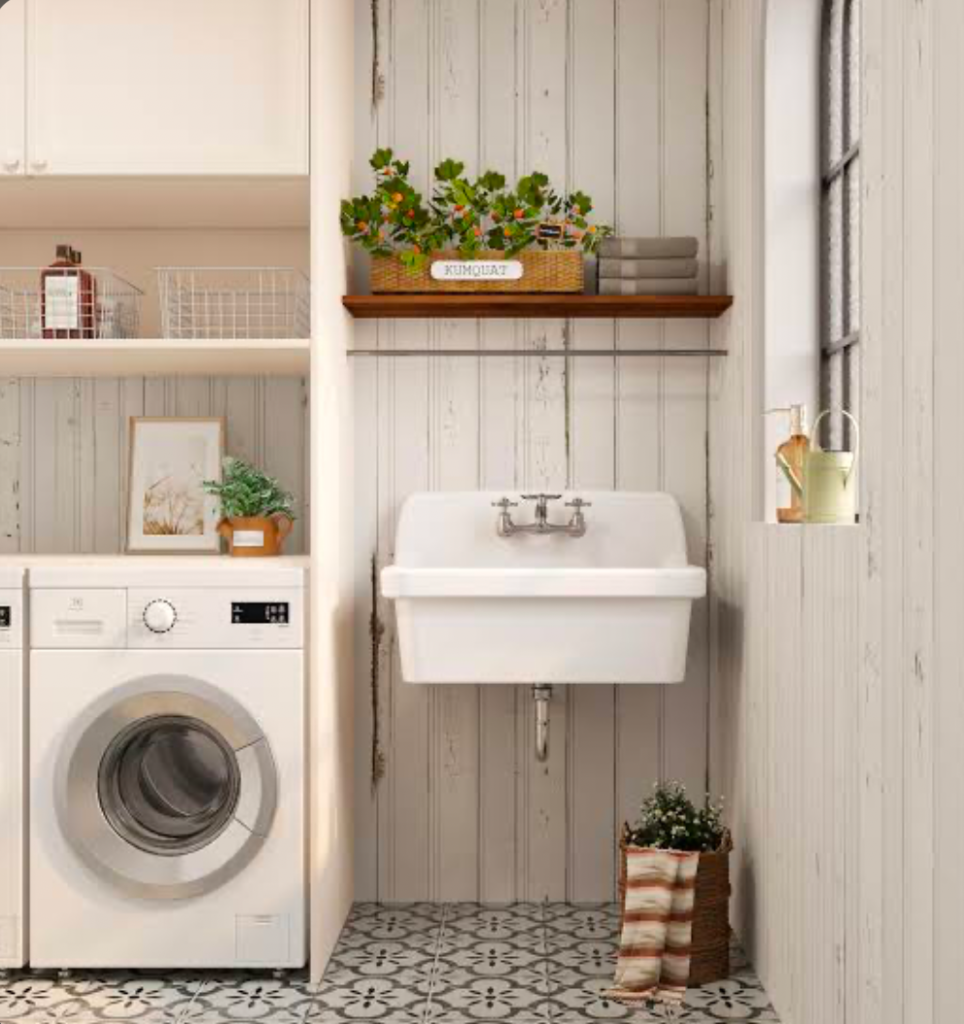 Farmhouse laundry area with washer, sink, and potted kumquat plant