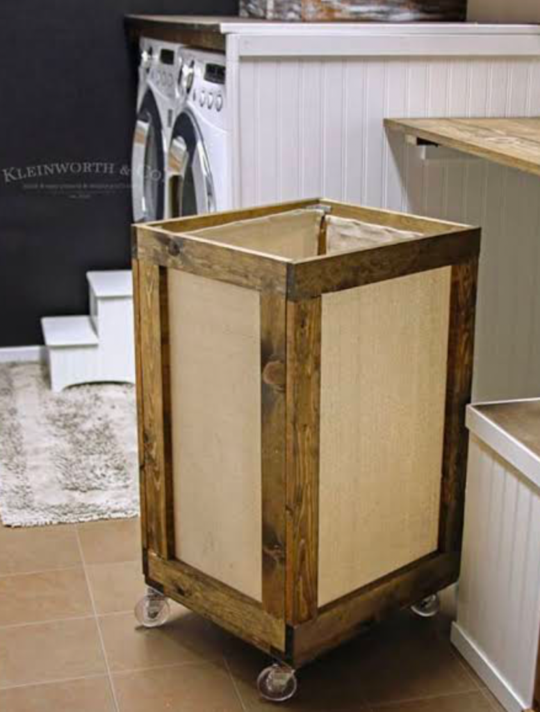 Rustic laundry basket on wheels with wooden frame and canvas sides