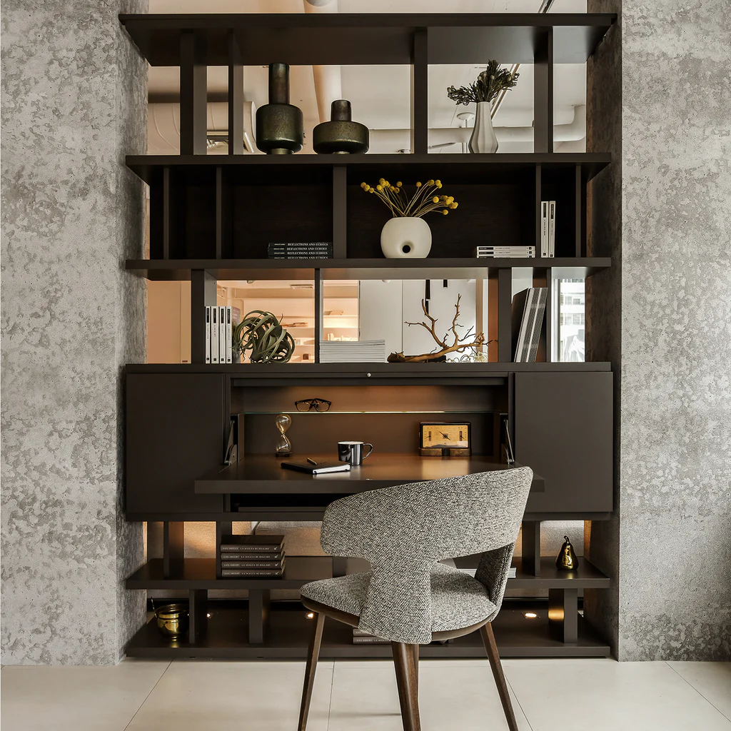 Modern floating desk design integrated into a wall shelving unit