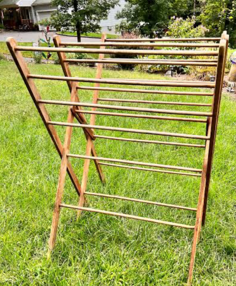 Wooden foldable outdoor drying rack on grass