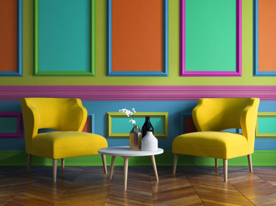 Multicolor paneled wall with yellow accent chairs