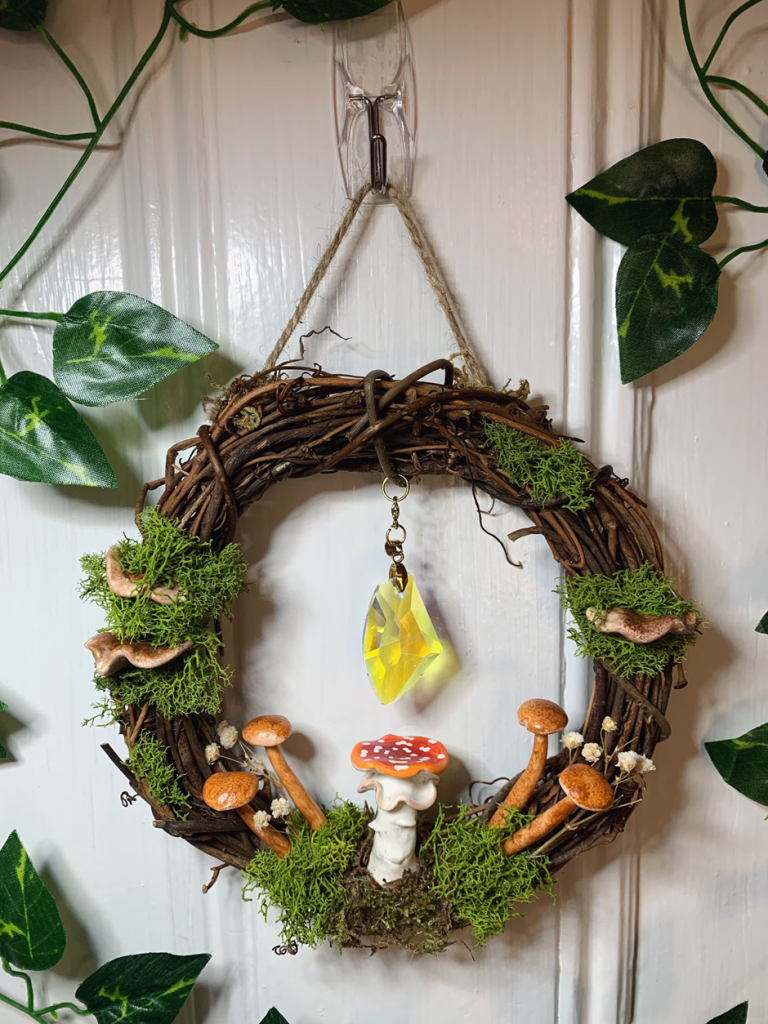 Small grapevine mushroom wreath with moss and hanging crystal charm