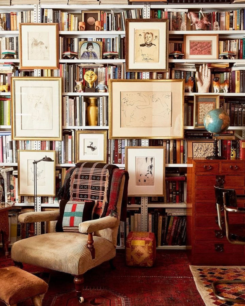 Cozy library nook with gallery wall and books