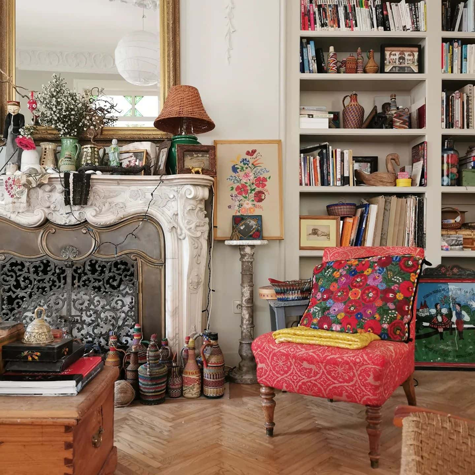 Eclectic Parisian fireplace vignette with vintage collectibles