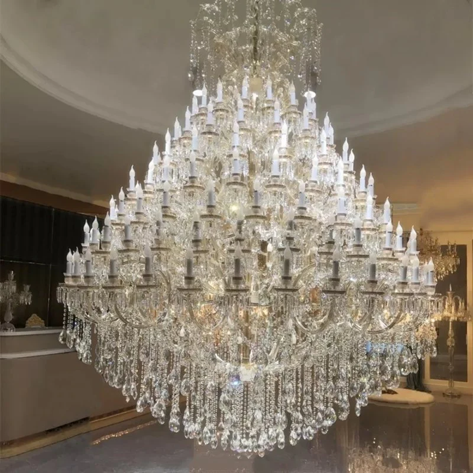 Massive crystal chandelier with cascading prisms in a grand interior.
