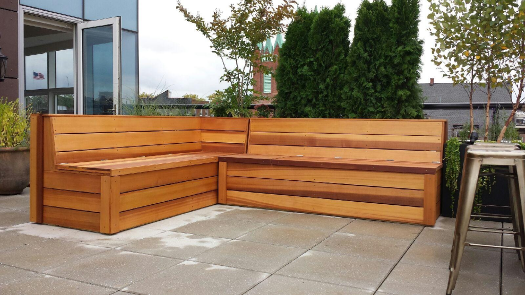 A rustic L-Shaped bench made from upcycled pallets.