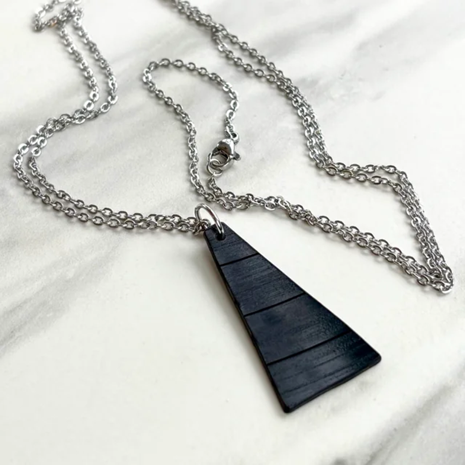 Recycled vinyl record pendant necklace on silver chain.