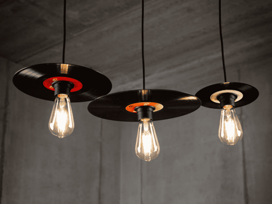Vinyl record pendant lights with Edison bulbs.